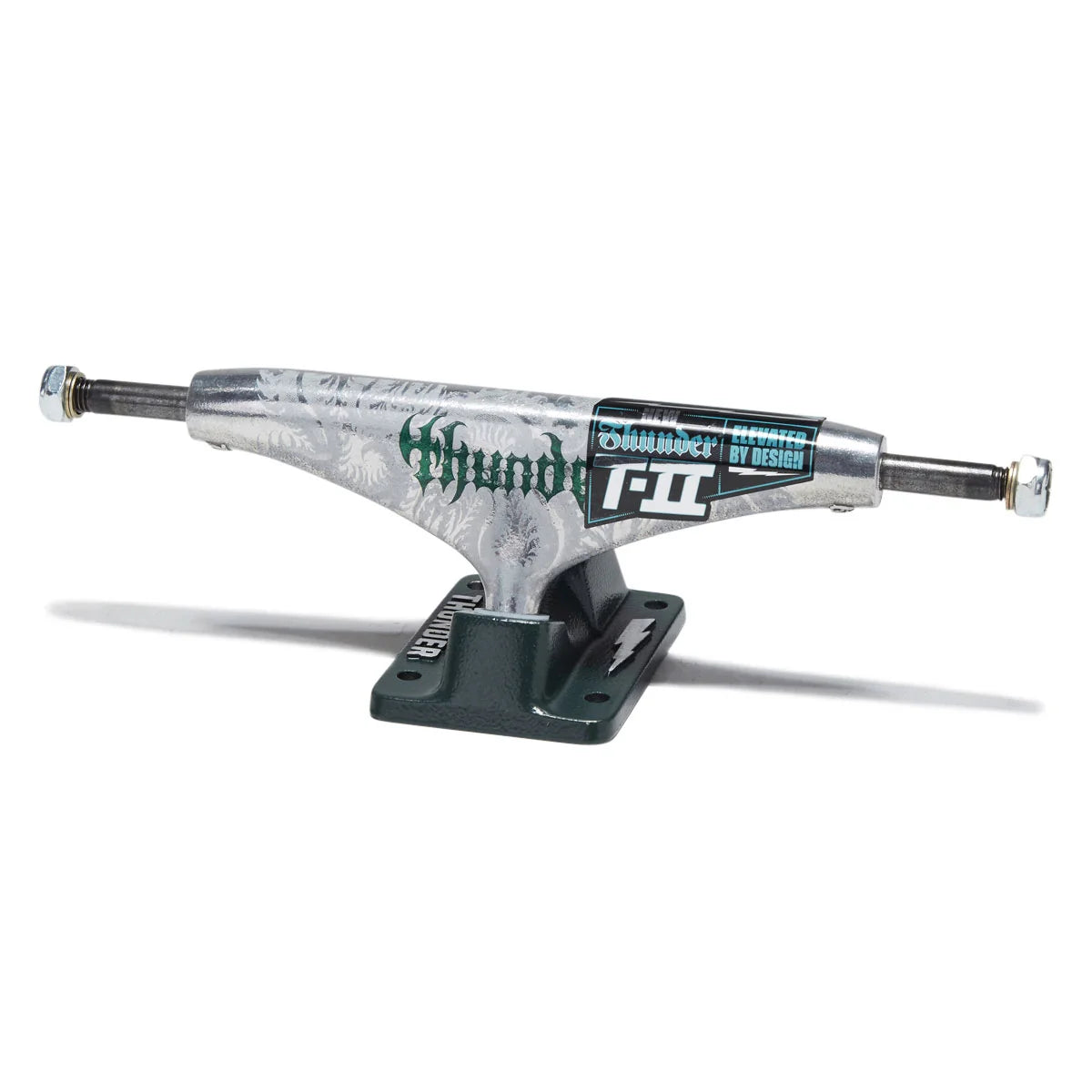 A single skateboard truck with a silver and white marbled graphic body, featuring green 'thunder' branding and a black 'T-II' sticker, mounted on a dark green base against a white background.
