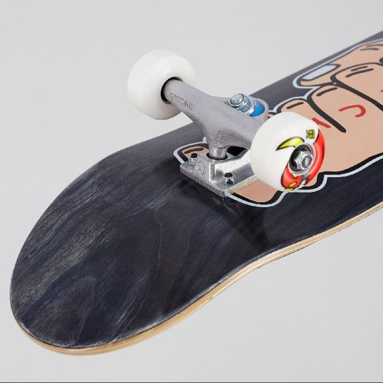 Close-up of a skateboard with a graphic design on a gray background