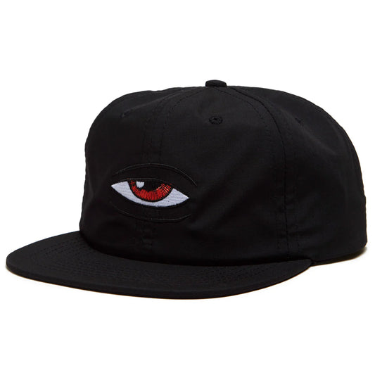 Black cap with an embroidered eye design on a white background