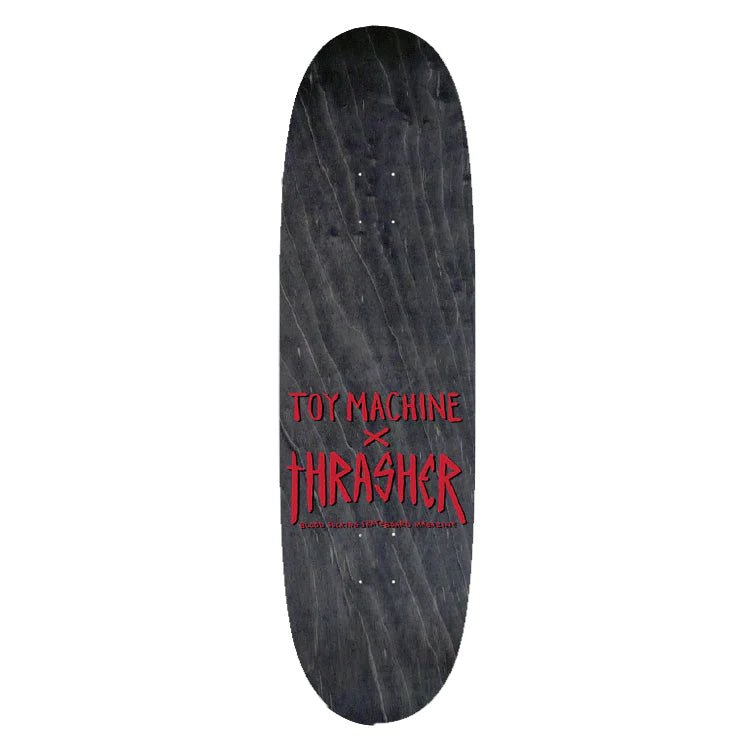 Skateboard deck with Toy Machine and Thrasher logos on a white background