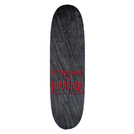 Skateboard deck with Toy Machine and Thrasher logos on a white background