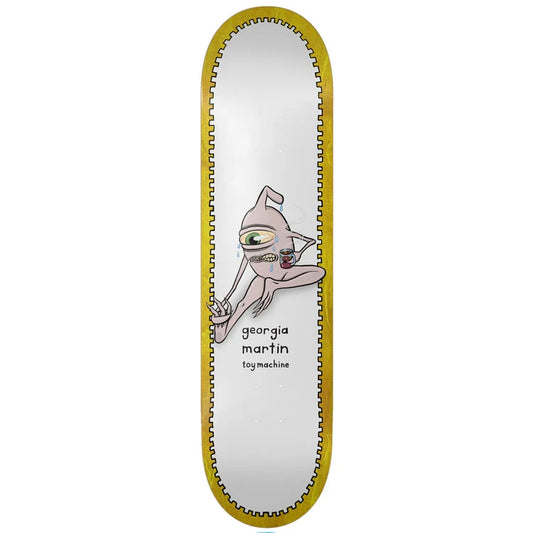A skateboard deck shown vertically against a plain white background. The deck has a white center with a cartoon character printed on it and the text 'georgia martin' and 'by machine'.