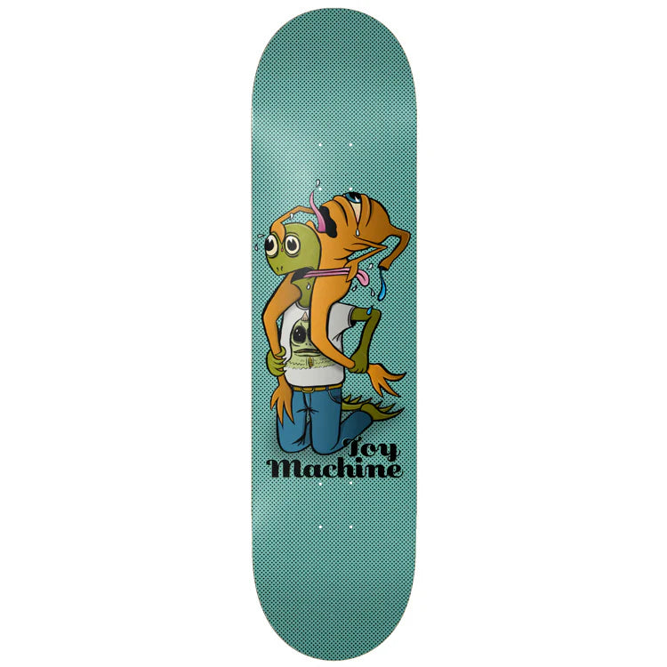 Skateboard deck with cartoon character and 'Toy Machine' branding on a teal background