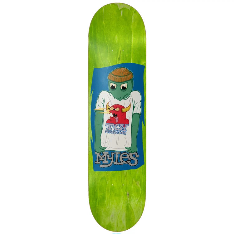 A skateboard deck with a bright green wood-grain finish, featuring a large graphic in the center. The graphic shows a green cartoon turtle wearing a brown beanie and a white t-shirt with a red bull logo, set against a blue background with the text 'MYLES' at the bottom.