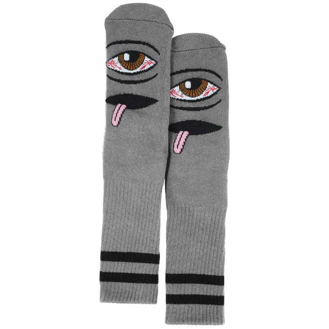 Gray knee-high socks with eye and tongue design on a white background