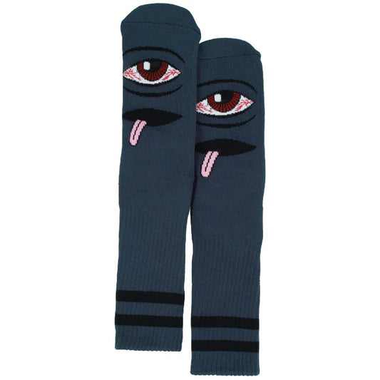 Pair of dark blue socks with eye and tongue design on a white background