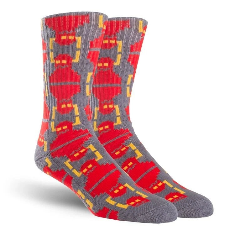 Gray socks with red and yellow geometric pattern on a white background