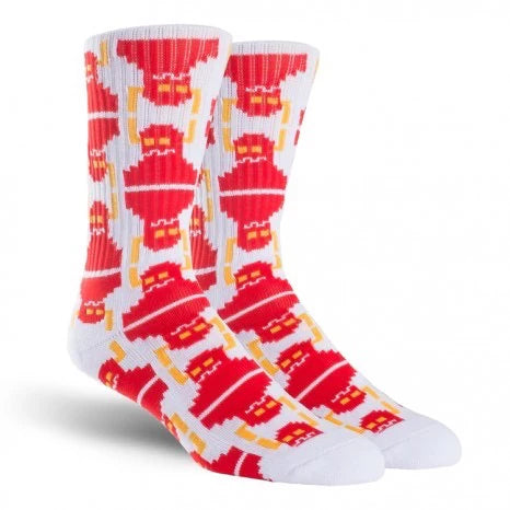 Red and white socks with a pattern of yellow and red shapes on a white background