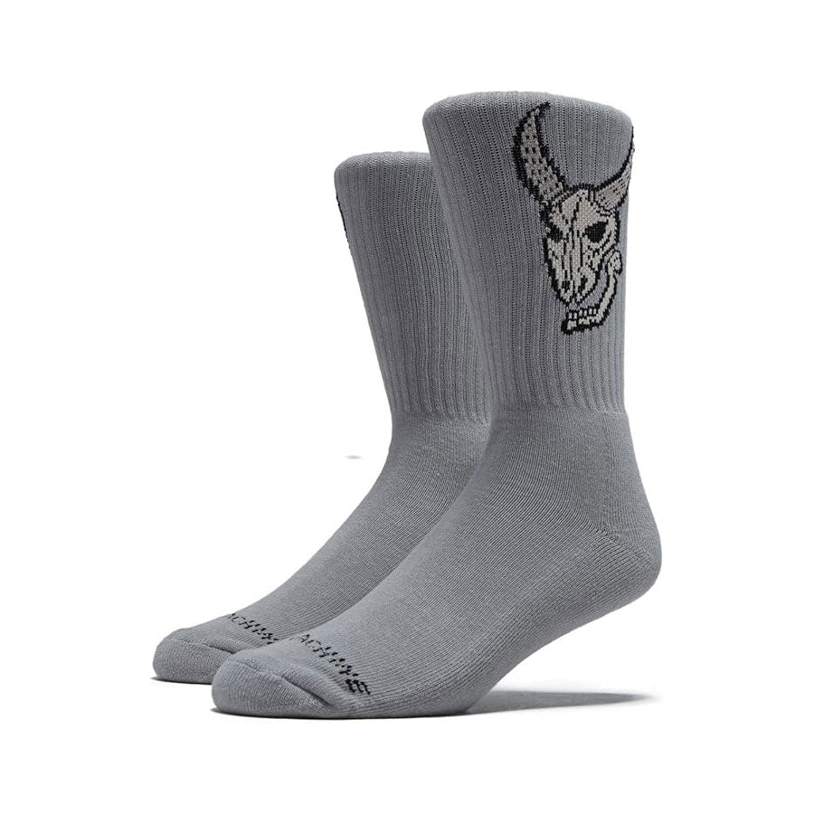 Gray socks with a skull design on a white background