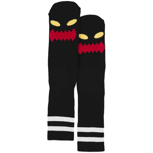 Black leg warmers with a angry face design on a white background