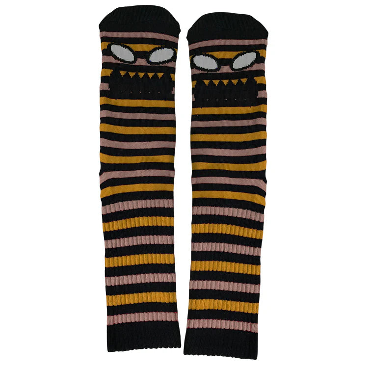 Pair of striped knee-high socks with black, yellow, and pink pattern on a white background