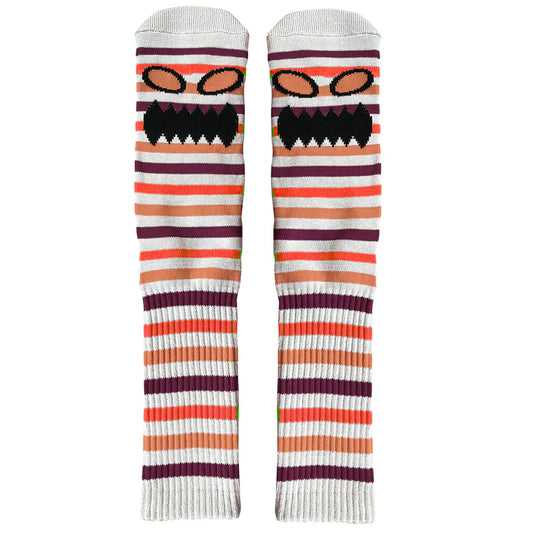 Pair of striped socks with a cartoon face design on a white background