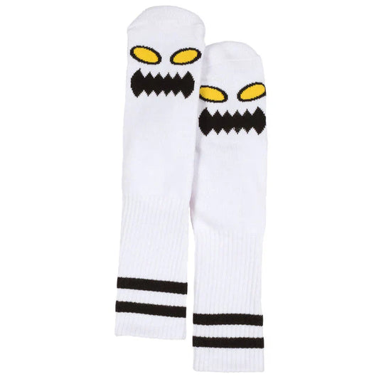 Pair of white socks with black and yellow designs on a white background