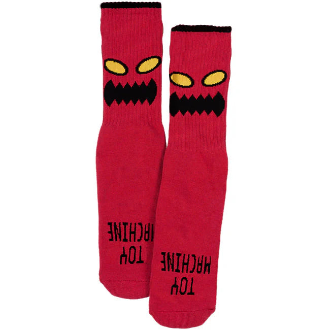 Red socks with black and yellow eye design on a white background