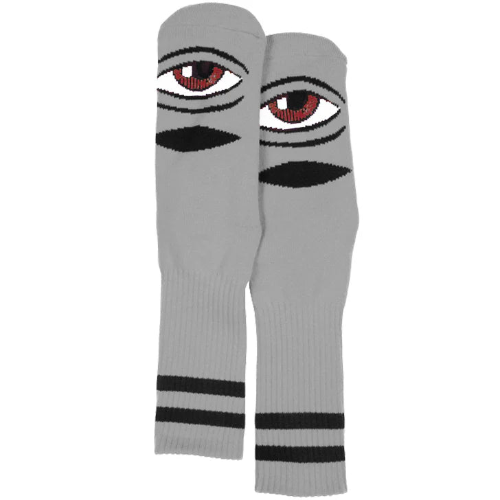 Gray knee-high socks with eye design on a white background