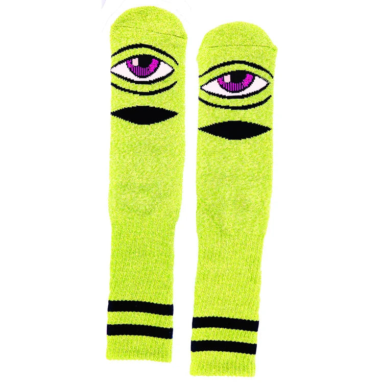 Pair of neon green socks with eye design on a white background