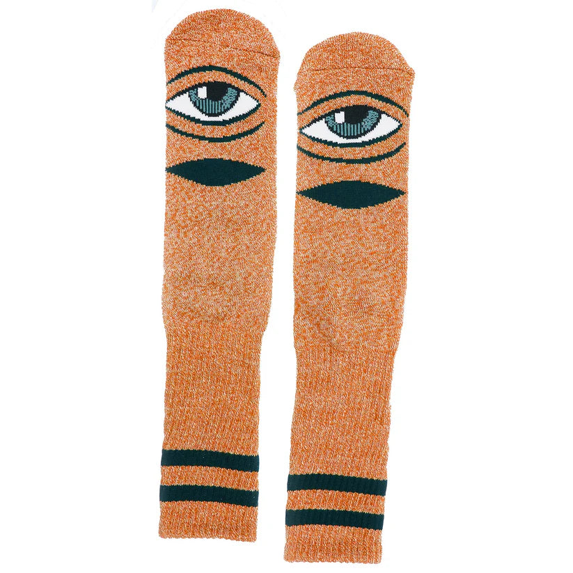 Pair of orange socks with eye design on a white background