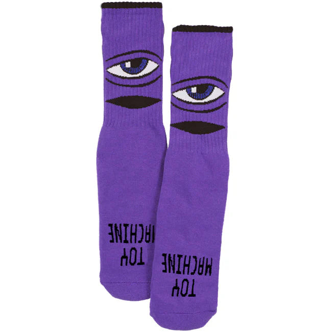 Purple socks with eye design and text on a white background