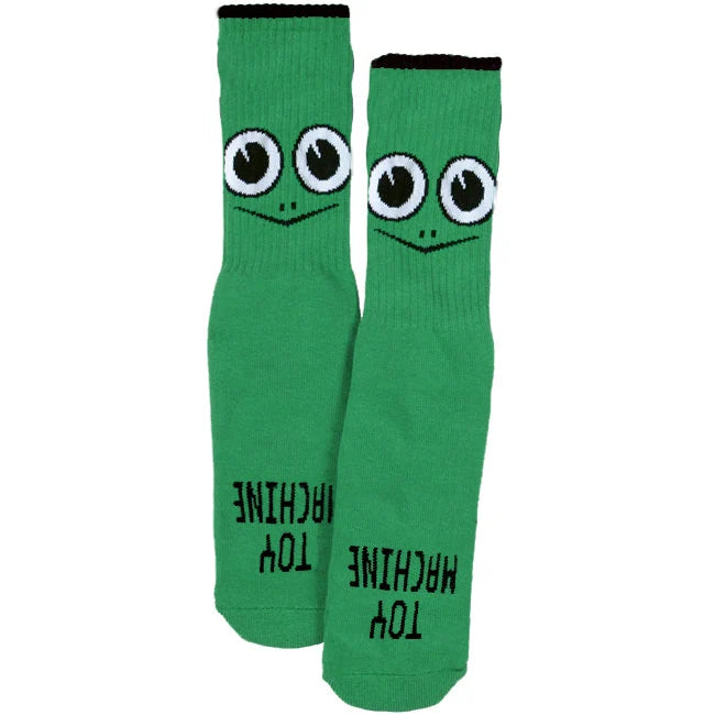Green socks with cartoon face design and text on a white background