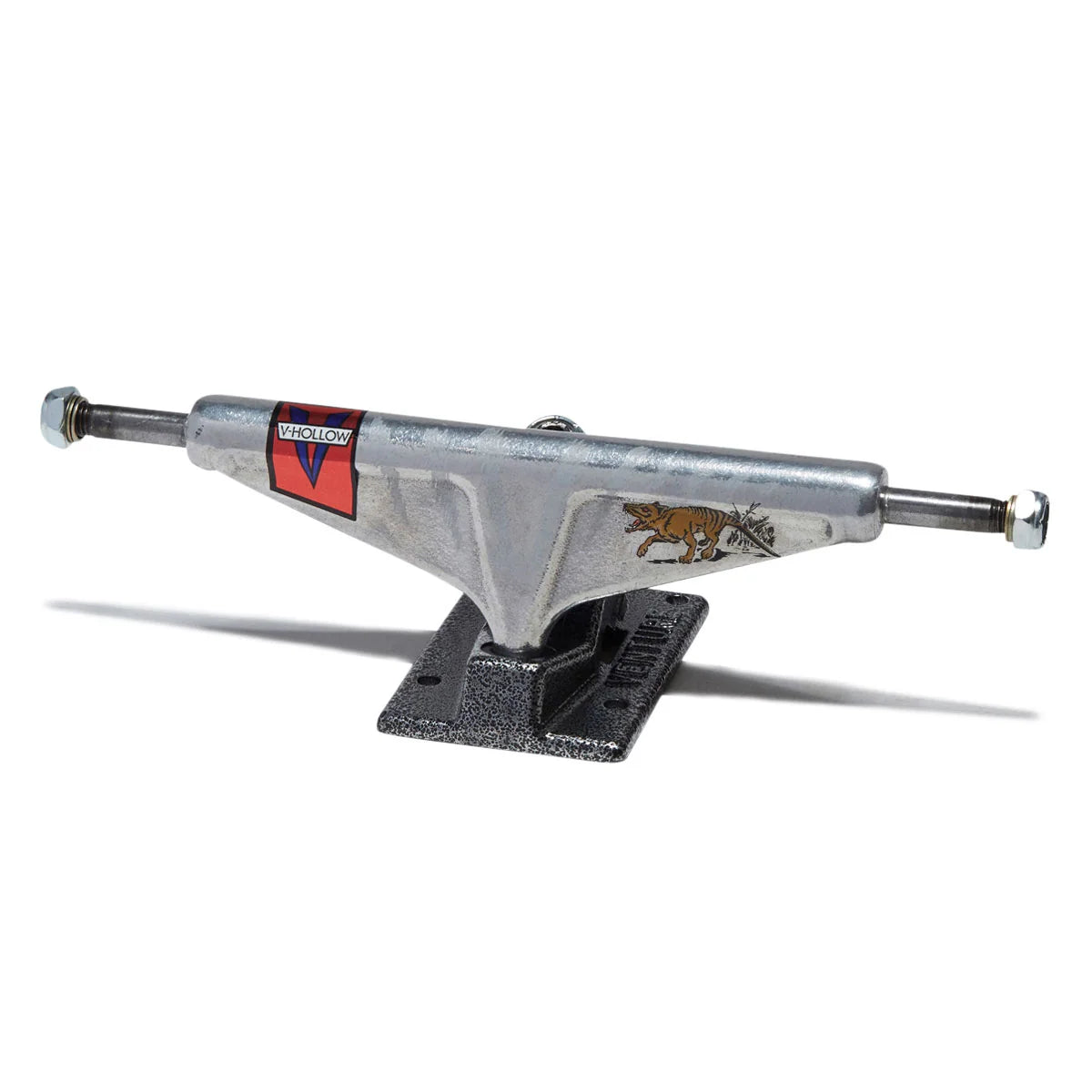 A single vintage-style skateboard truck with a silver metal body, black mounting base, and red and gold graphics, shown on a plain white background.