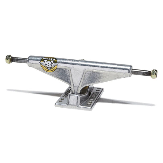 A single silver metal skateboard truck with a visible Kollhoff logo decal on the side, set against a plain white background with a soft shadow.