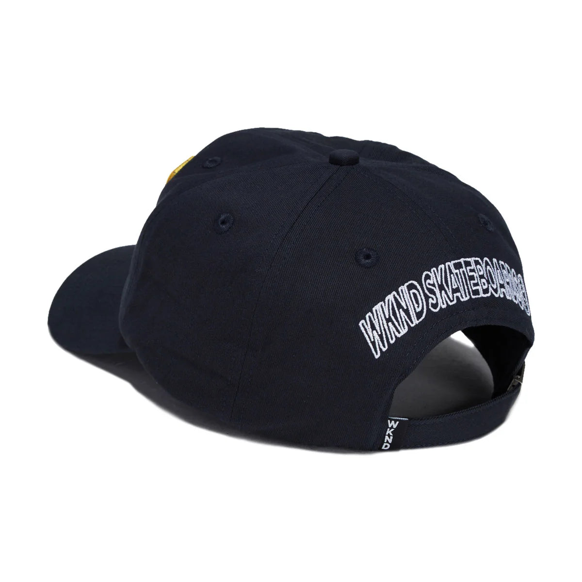 A dark navy blue baseball cap shown from a three-quarters angle, featuring 'WKND SKATEBOARDS' embroidered in white arched text on the side and a small yellow accent on the opposite side panel.
