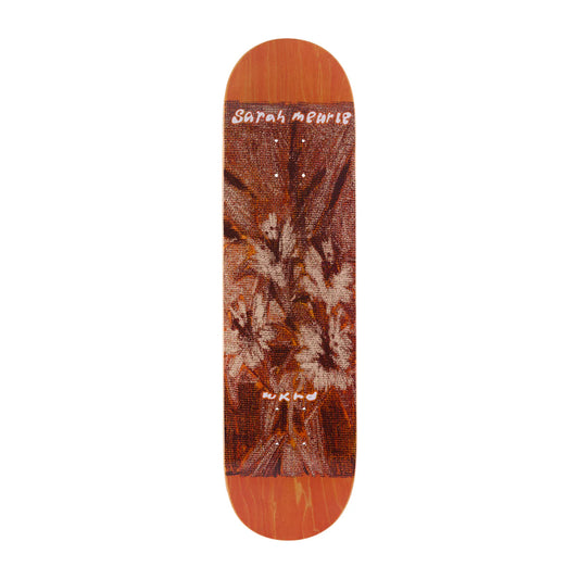 Skateboard deck with a brown and orange design on a white background
