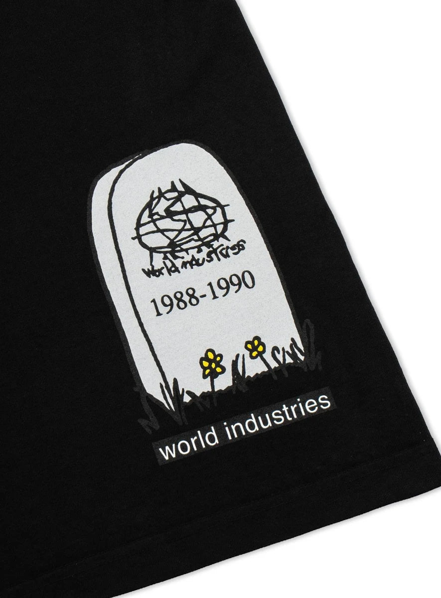 Close-up of a black garment with a white tombstone graphic printed on it, featuring the text 'world industries', '1988-1990', and small yellow flowers.