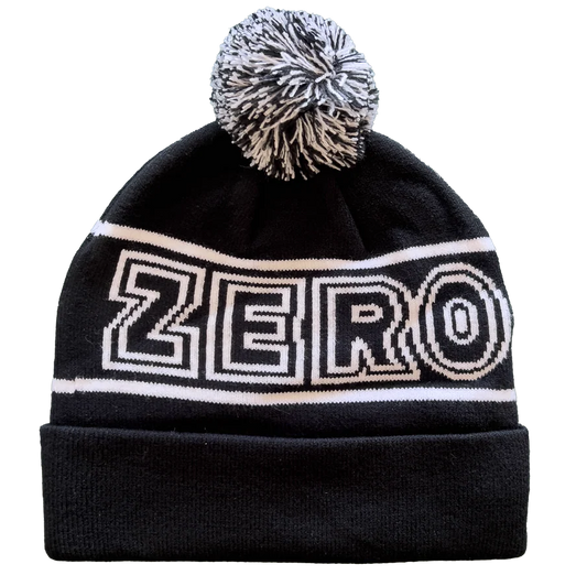 Black beanie with 'ZERO' logo and pom-pom on a white background