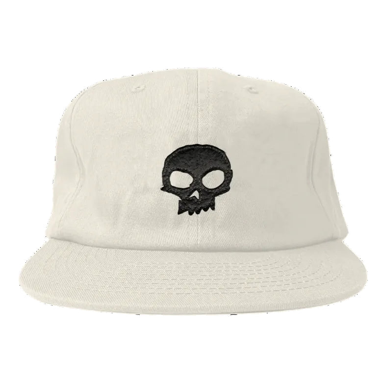 Beige cap with a black skull design on a white background