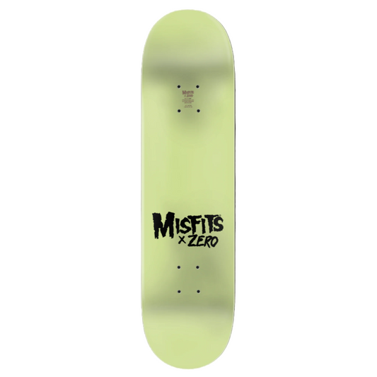 Glow-in-the-dark skateboard deck with 'Misfits x Zero' text on a black background