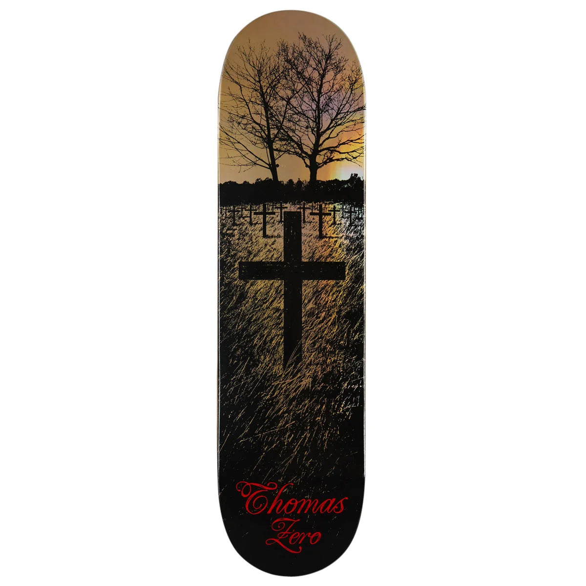 A Thomas Zero skateboard deck featuring a graphic design of a cross over a field of grass at sunset, with bare trees in the background and the brand name in red script at the bottom.