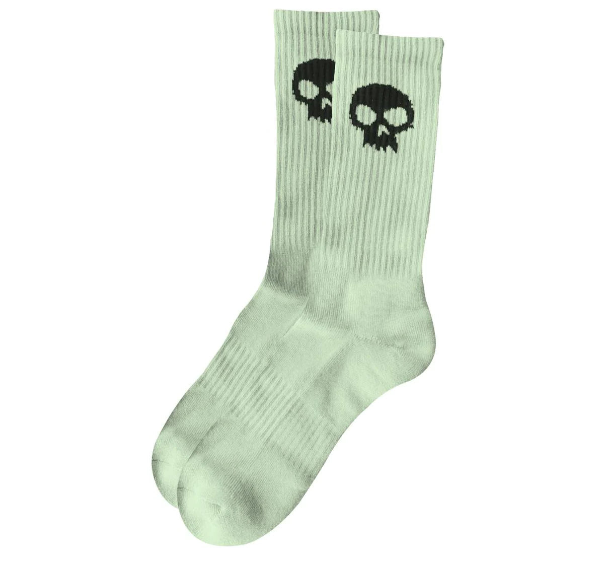 Light green socks with black skull design on a white background