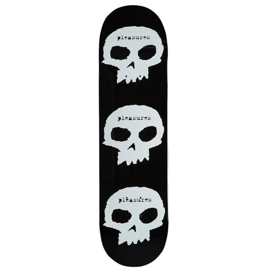 Skateboard deck with white skulls and 'Pleasures' text on a black background