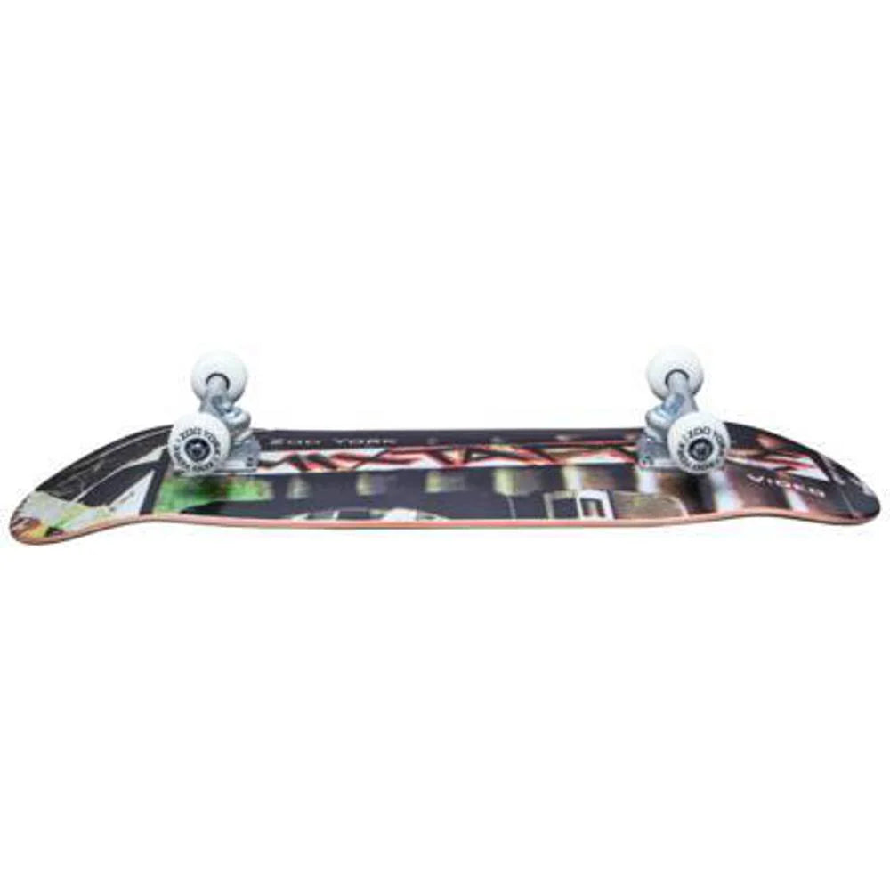 Skateboard with a colorful deck and silver trucks on a white background