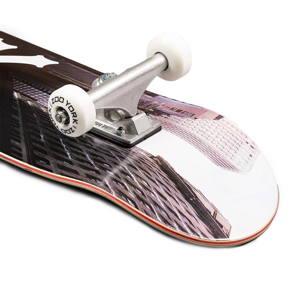 Close-up of a skateboard with trucks and wheels on a white background
