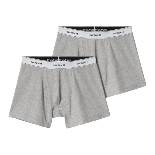 Two pairs of gray boxer briefs with Carhartt branding on a white background