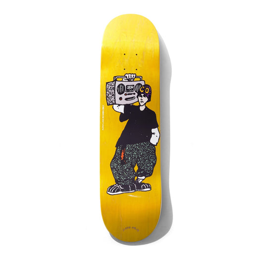 Skateboard deck with a graphic design of a person holding a radio on a yellow background