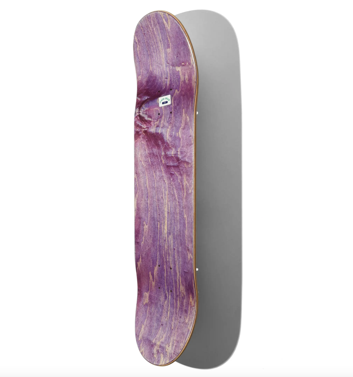 Purple and gold skateboard deck on a white background