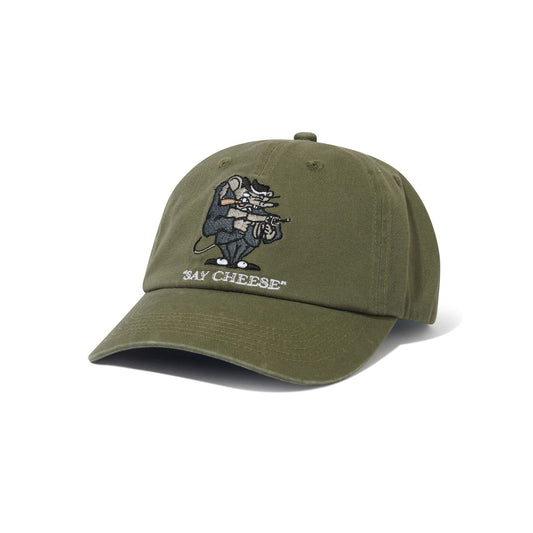 Green cap with a graphic design and 'Say Cheese' text on a white background