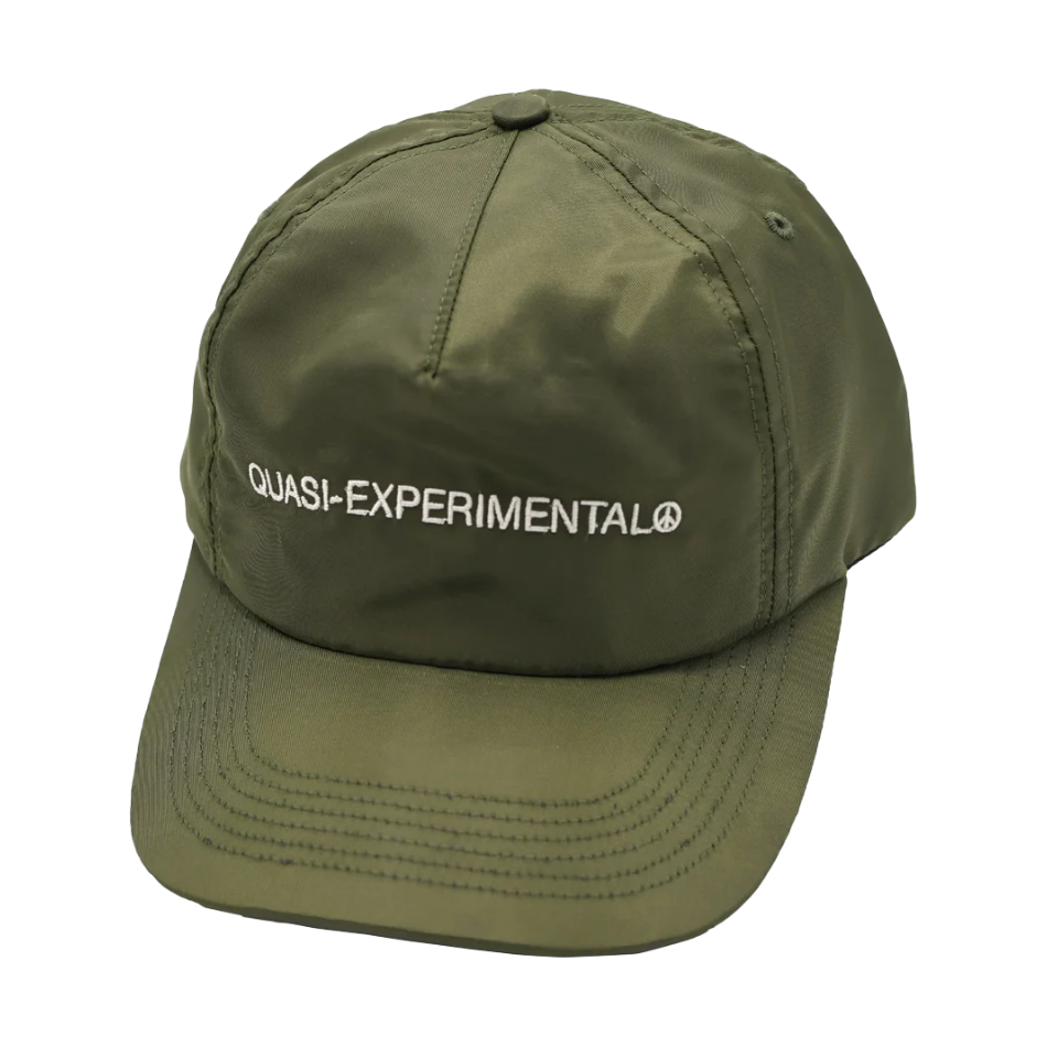 Green cap with 'QUASI-EXPERIMENTAL' text on a white background