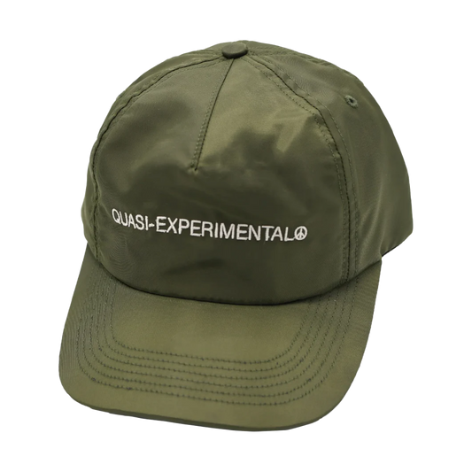 Green cap with 'QUASI-EXPERIMENTAL' text on a white background